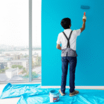 Painter applying light blue